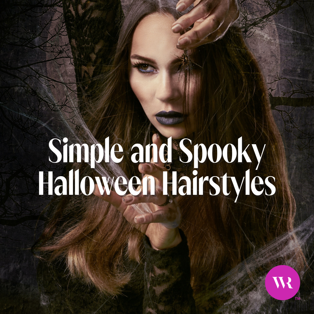 A woman with brown wavy hair dressed up as a vampire during halloween