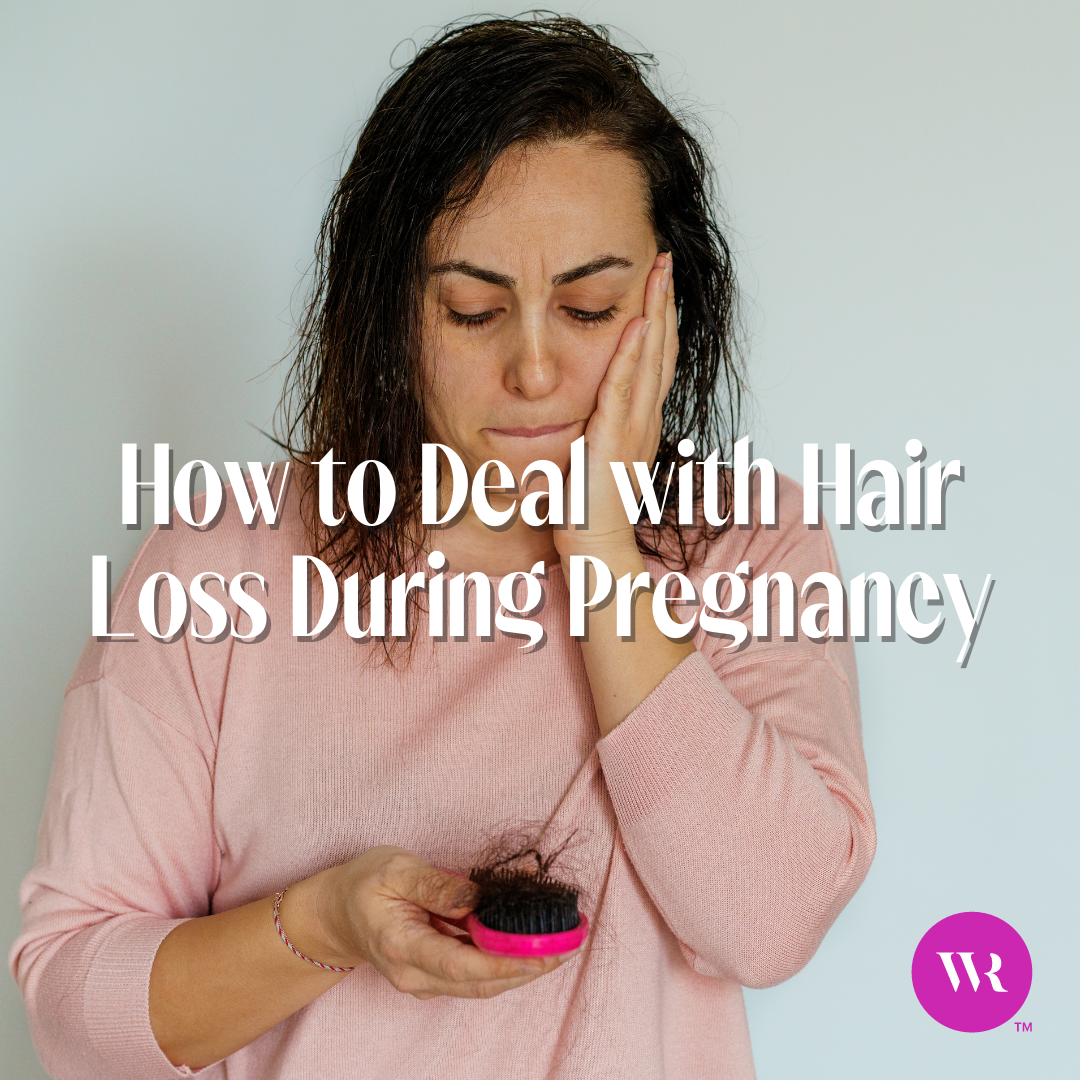 Woman looking at her hair brush stressed about the amount of hair she is losing