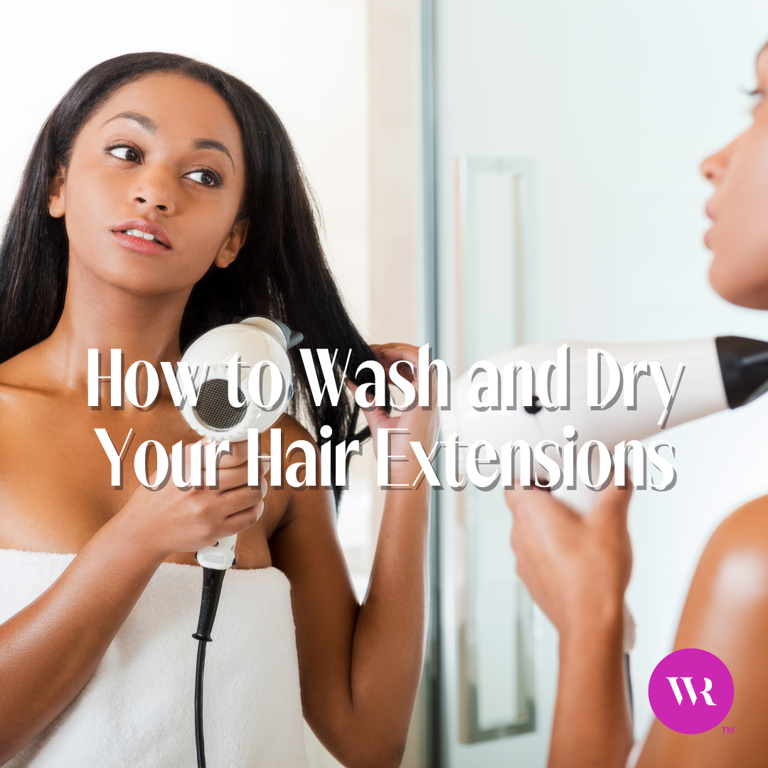 Woman blow drying her hair in the mirror